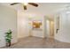 Bright living room featuring modern floors, an open layout and views into the adjacent kitchen space at 3823 Parkridge Cir # 1-101, Sarasota, FL 34243