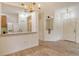 Open-concept living space with wood floors, a view of the kitchen, and neutral paint at 3823 Parkridge Cir # 1-101, Sarasota, FL 34243