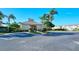 Community pool house with ample parking and well-manicured landscaping at 3823 Parkridge Cir # 1-101, Sarasota, FL 34243