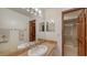 Bathroom with granite countertop, vanity with mirror, and walk-in shower at 3837 Torrey Pines Blvd, Sarasota, FL 34238
