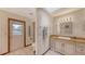 Bright bathroom featuring a vanity with granite countertop and outdoor access at 3837 Torrey Pines Blvd, Sarasota, FL 34238