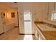 Bathroom featuring granite countertop, custom mirror, and a soaking tub at 3837 Torrey Pines Blvd, Sarasota, FL 34238