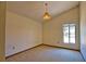 Bedroom with vaulted ceiling, window view and vintage light fixture at 3837 Torrey Pines Blvd, Sarasota, FL 34238