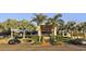 An opulent clubhouse with palm trees in front and an upper stairway at 3837 Torrey Pines Blvd, Sarasota, FL 34238