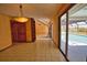 Open-concept dining room with easy access to the pool and views of the outdoor area at 3837 Torrey Pines Blvd, Sarasota, FL 34238