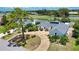 Well-maintained single-Gathering home on a landscaped lot with circular driveway and serene water views at 3837 Torrey Pines Blvd, Sarasota, FL 34238