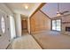 Inviting foyer that leads to the living room with fireplace and offers access to other rooms at 3837 Torrey Pines Blvd, Sarasota, FL 34238