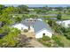 Picture of the home's front exterior, featuring a well manicured yard and water view at 3837 Torrey Pines Blvd, Sarasota, FL 34238