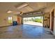 Open garage space with storage and view of front yard at 3837 Torrey Pines Blvd, Sarasota, FL 34238