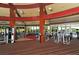 Fully equipped gym with weight and cardio machines offering views of the neighborhood at 3837 Torrey Pines Blvd, Sarasota, FL 34238