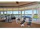 Workout with a view in the community gym that overlooks the lake and tennis courts at 3837 Torrey Pines Blvd, Sarasota, FL 34238