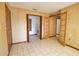 Spacious living room with tile flooring and multiple doorways at 3837 Torrey Pines Blvd, Sarasota, FL 34238