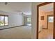 Spacious main bedroom featuring a sliding glass door to the outdoor patio and an ensuite bathroom at 3837 Torrey Pines Blvd, Sarasota, FL 34238