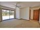 Bright main bedroom featuring private outdoor access, neutral walls, and ample space at 3837 Torrey Pines Blvd, Sarasota, FL 34238