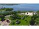 Expansive community park featuring a playground, sandy beach, and lush tropical landscaping by the serene bay at 408 Bryn Mawr Is, Bradenton, FL 34207