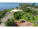 Beautiful aerial view of a community park, playground, and a picturesque beach overlooking tranquil waters at 408 Bryn Mawr Is, Bradenton, FL 34207