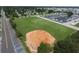Wide aerial shot of a well-kept baseball field and marina set amongst a green and vibrant community at 408 Bryn Mawr Is, Bradenton, FL 34207