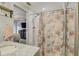 Shower room adjacent to bathroom with marble vanity; the design scheme flows seamlessly from room to room at 408 Bryn Mawr Is, Bradenton, FL 34207