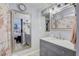 Bathroom with a marble vanity, mirror, and luxurious decor; access to bedroom and shower room is available at 408 Bryn Mawr Is, Bradenton, FL 34207