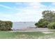 Community beach area with fishing and boating, with lush greenery surrounding a sandy coastline at 408 Bryn Mawr Is, Bradenton, FL 34207