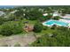 Lush community park featuring playground and pool, all set within a serene, tree-lined environment at 408 Bryn Mawr Is, Bradenton, FL 34207