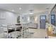 Dining area featuring a large table with seating, modern decor, and stylish lighting, perfect for gatherings at 408 Bryn Mawr Is, Bradenton, FL 34207