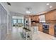 Bright kitchen featuring custom cabinets, stainless steel appliances, a kitchen island and views to the living area at 408 Bryn Mawr Is, Bradenton, FL 34207