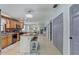 Open kitchen with custom cabinets, a kitchen island with seating, and a seamless connection to the living spaces at 408 Bryn Mawr Is, Bradenton, FL 34207