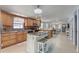 Spacious kitchen features custom cabinets, an island with seating, and a seamless design with the living area at 408 Bryn Mawr Is, Bradenton, FL 34207