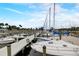 View of a marina with numerous boats docked, showcasing the waterfront lifestyle and boating opportunities at 408 Bryn Mawr Is, Bradenton, FL 34207