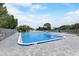 This community pool area offers spacious lounging with gray pavers around both pools at 408 Bryn Mawr Is, Bradenton, FL 34207