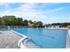 This community pool is large with lounge chairs and umbrellas for relaxation and enjoyment at 408 Bryn Mawr Is, Bradenton, FL 34207