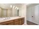 Bright bathroom with double sinks, walk-in shower, tile floors, and neutral walls for a modern, clean look at 428 Bocelli Dr, North Venice, FL 34275