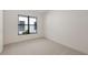 Bright bedroom with neutral carpet and a window at 428 Bocelli Dr, North Venice, FL 34275