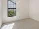 Carpeted bedroom with a view to the outdoors through a large window at 428 Bocelli Dr, North Venice, FL 34275