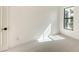 Bright bedroom featuring neutral carpet, a window with natural light, and white walls at 428 Bocelli Dr, North Venice, FL 34275