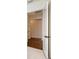 Hallway leading to another room with hardwood floors at 428 Bocelli Dr, North Venice, FL 34275