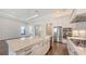 Spacious kitchen with large island, stainless steel appliances, white cabinets and light countertops at 428 Bocelli Dr, North Venice, FL 34275