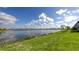 Serene lake view with clear skies and lush greenery, showing a scenic outdoor space at 428 Bocelli Dr, North Venice, FL 34275