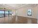 Spacious living room features wood floors, tray ceiling, recessed lighting, and access to the outdoor pool at 428 Bocelli Dr, North Venice, FL 34275