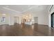 Bright open-concept living area with modern kitchen, wood floors, and ample natural light at 428 Bocelli Dr, North Venice, FL 34275