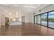 Spacious living room with hardwood floors and large sliding doors at 428 Bocelli Dr, North Venice, FL 34275
