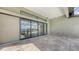 Expansive screened-in patio with travertine floors, leads to a luxurious pool, spa, and lake at 428 Bocelli Dr, North Venice, FL 34275