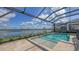 Enclosed pool with a great view of the lake and natural surroundings at 428 Bocelli Dr, North Venice, FL 34275