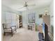 Bright bedroom with desk, bookcase, and a sunny window view at 4338 Center Pointe Ln # 5, Sarasota, FL 34233