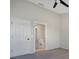 Bedroom featuring carpeted floors, ceiling fan and access to the en-suite bathroom at 4717 Sabal Key Dr, Bradenton, FL 34203