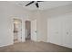 Bedroom featuring carpet, ceiling fan, and large closet doors at 4717 Sabal Key Dr, Bradenton, FL 34203