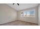 Bedroom with carpet, bright window with shutter blinds, and large closet at 4717 Sabal Key Dr, Bradenton, FL 34203