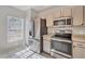 Bright kitchen featuring modern stainless steel appliances and granite countertops at 4717 Sabal Key Dr, Bradenton, FL 34203