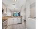 Bright kitchen with stainless steel appliances, granite countertops, and a view to the water at 4717 Sabal Key Dr, Bradenton, FL 34203